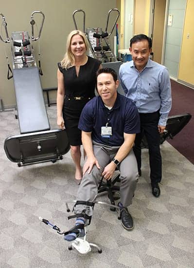 (back) Innovation Lab team members Suzy Engwall and Hieu Le present five DARTs to inventor (front center) Scott Rogoff, Doctor of Physical Therapy at St Jude Centers for Rehabilitation and Wellness. (Image courtesy of The Innovation Lab)